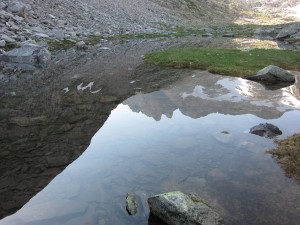 The reflection of Malh des Puis, the north end of the ridge leading to Tuc de Mulleres The reflection of Malh des Puis, the north end of the ridge leading to Tuc de Mulleres